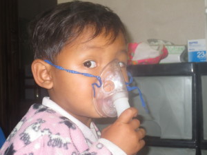 BrooMoo, the adorable 2 year old who is so used to his asthma and what I do that he comes and stands right in front of me, pulls his shirt up so I can listen to his lungs. Lifts his arms so he can have his temperature taken, and when I am ready he takes the oxygen masks and holds it himself the entire 15 or 20 mins. He kneels and prays with me and then shakes my hand as he leaves. It is very hard for me to see him suffer with asthma because I love him so much.