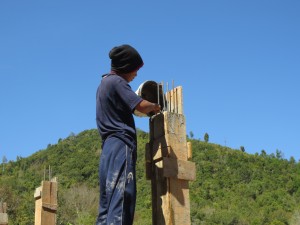 Filling the posts with cement.