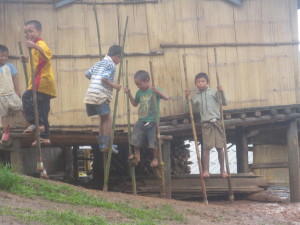 They also love to walk on their home made stilts.  The very small children could do it well, even on the muddy slope in the rain!