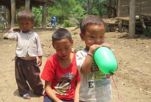 The children play while waiting for their dinner.