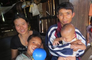 ShePaw, her husband and the 2 youngest of their 6 children.